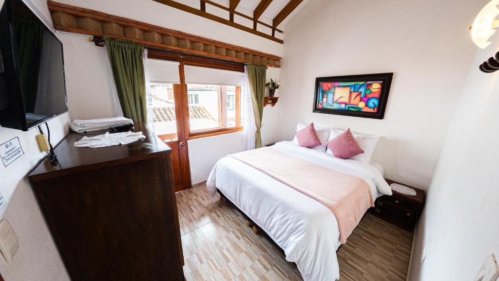 Letto o letti in una camera di ApartaHotel Margaritas de la Villa VDL