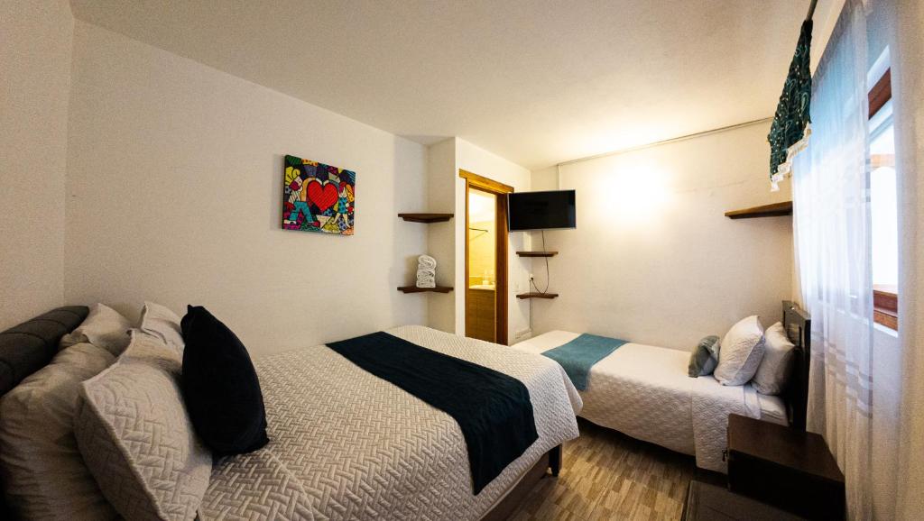 Letto o letti in una camera di ApartaHotel Margaritas de la Villa VDL