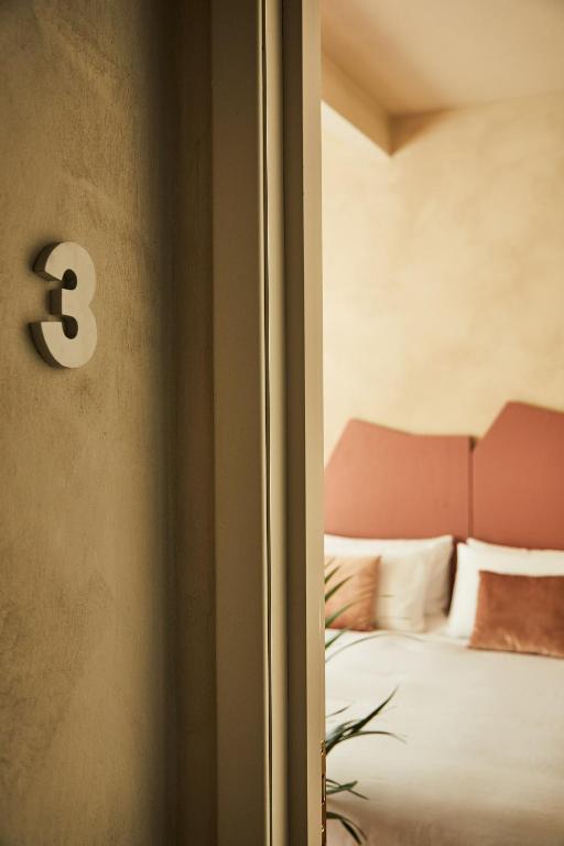 Łóżko lub łóżka w pokoju w obiekcie Locanda Ca' Matilde