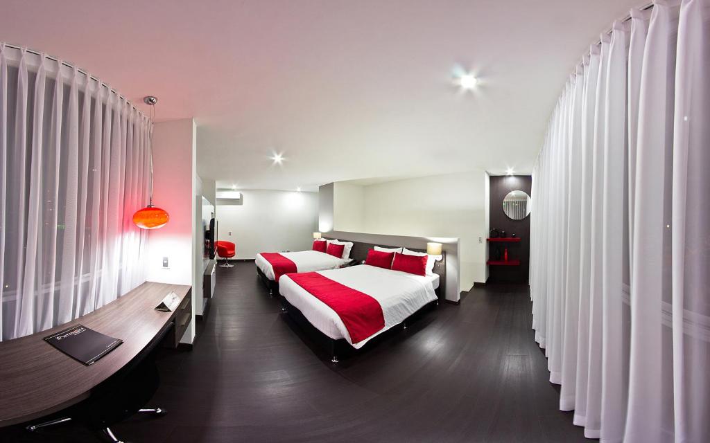 Postel nebo postele na pokoji v ubytování Monterosa Apartamentos Amoblados