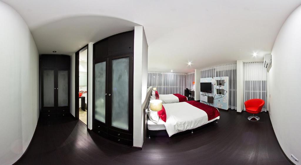 Postel nebo postele na pokoji v ubytování Monterosa Apartamentos Amoblados