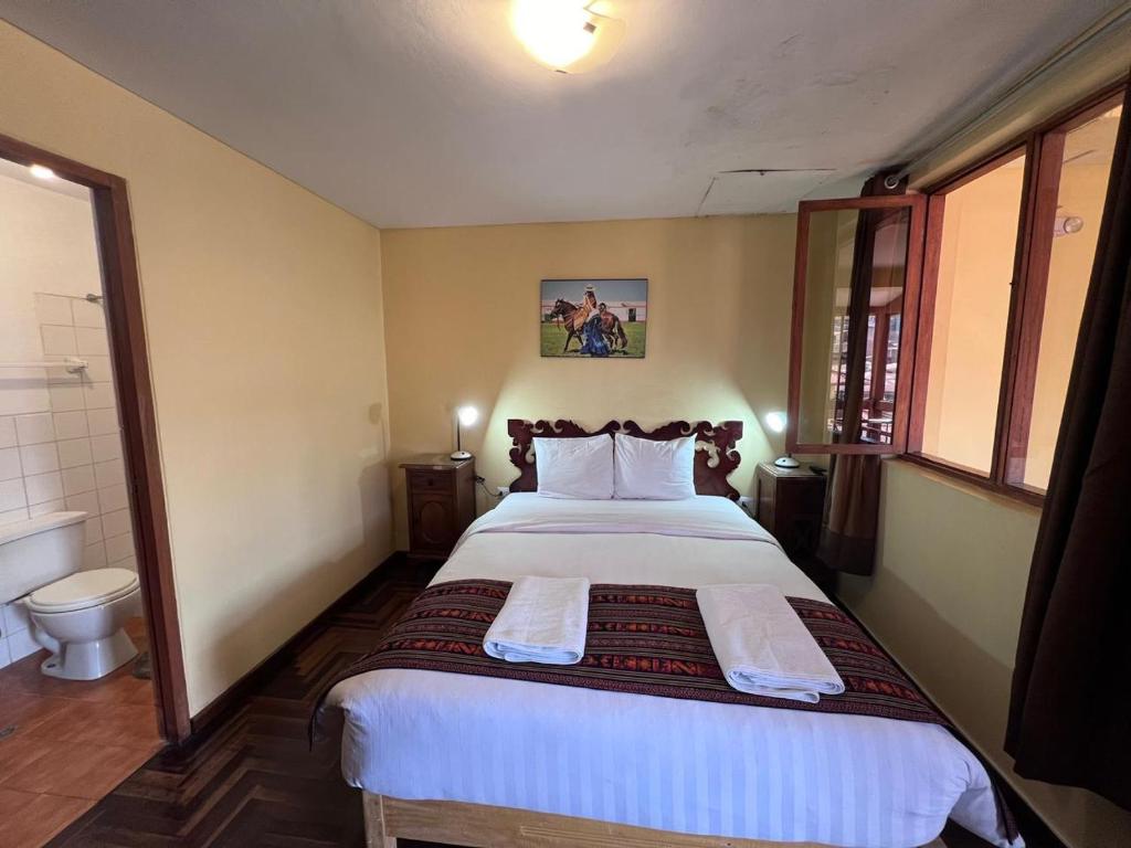 Postel nebo postele na pokoji v ubytování Eco Inn