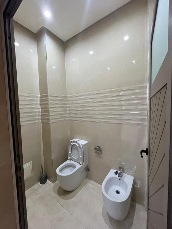 a bathroom with a toilet and a sink at Villa iligh in Agadir