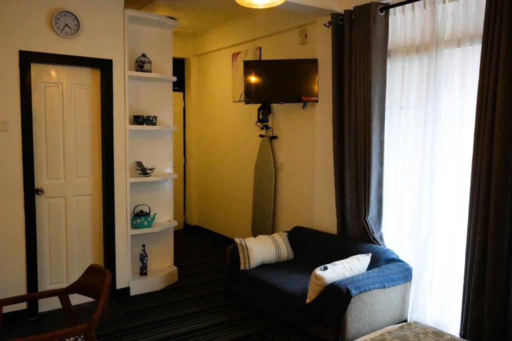 TV a/nebo společenská místnost v ubytování AWHILE CASA