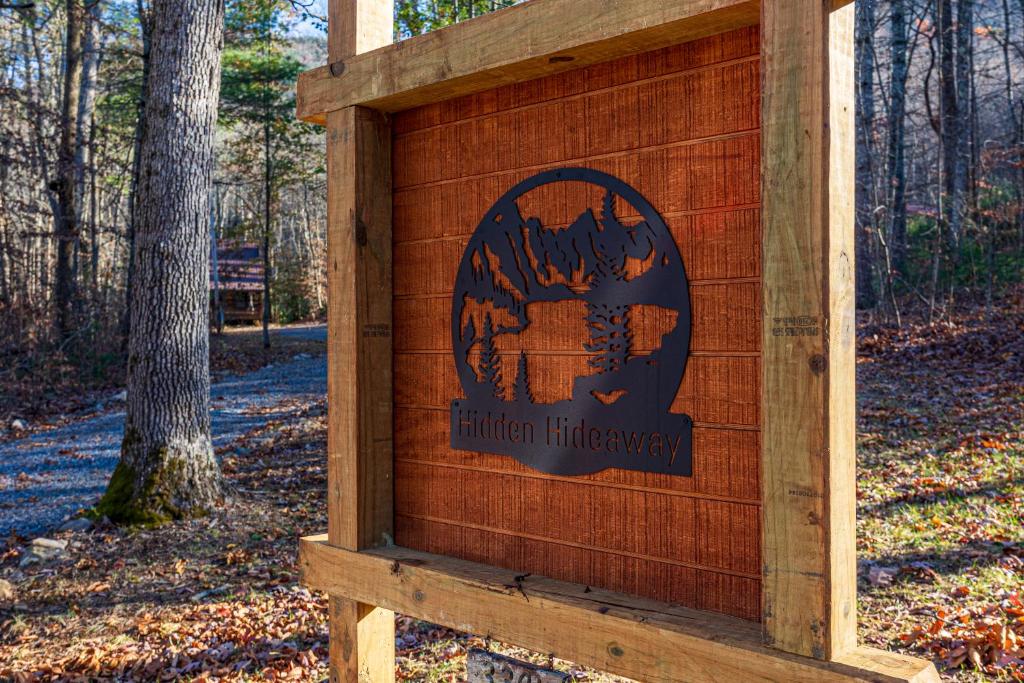 a wooden sign for a union fireagency in a forest at Hidden Hideaway in Cosby