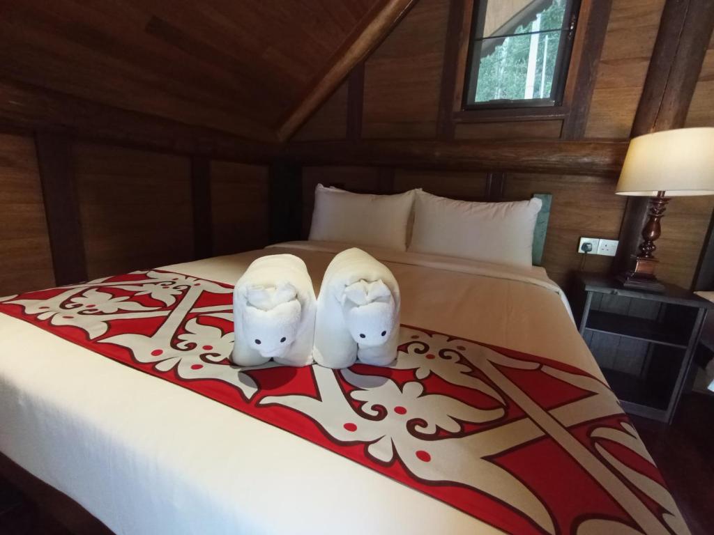 Postel nebo postele na pokoji v ubytování Naluyan Jungle Lodge