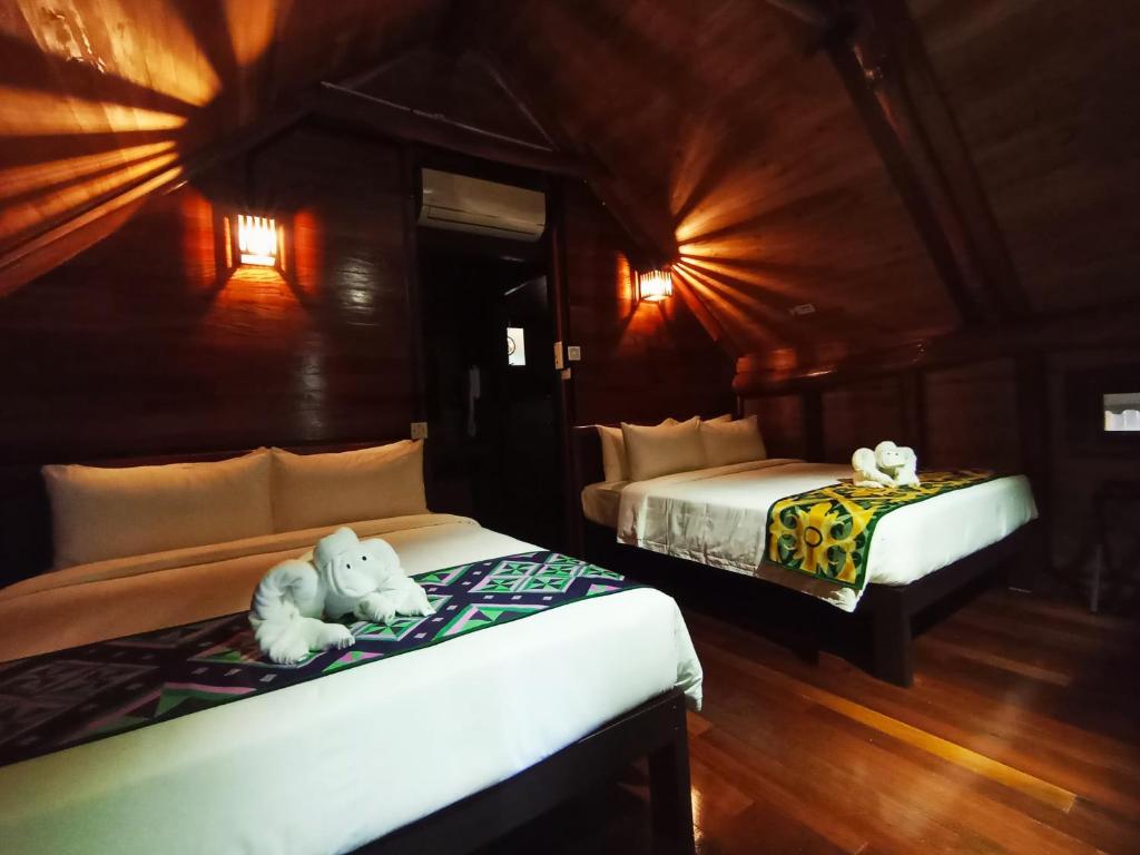 Postel nebo postele na pokoji v ubytování Naluyan Jungle Lodge