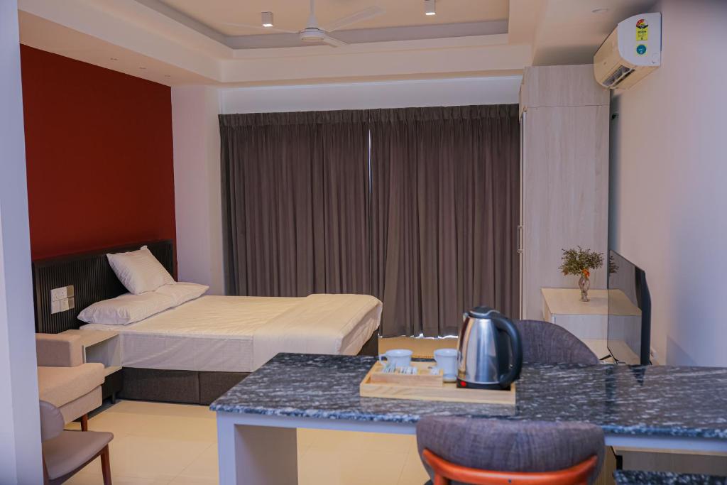 En eller flere senge i et værelse på Prime Holiday