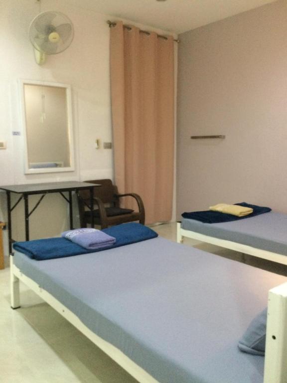 Postel nebo postele na pokoji v ubytování Ananas Samui Hostel