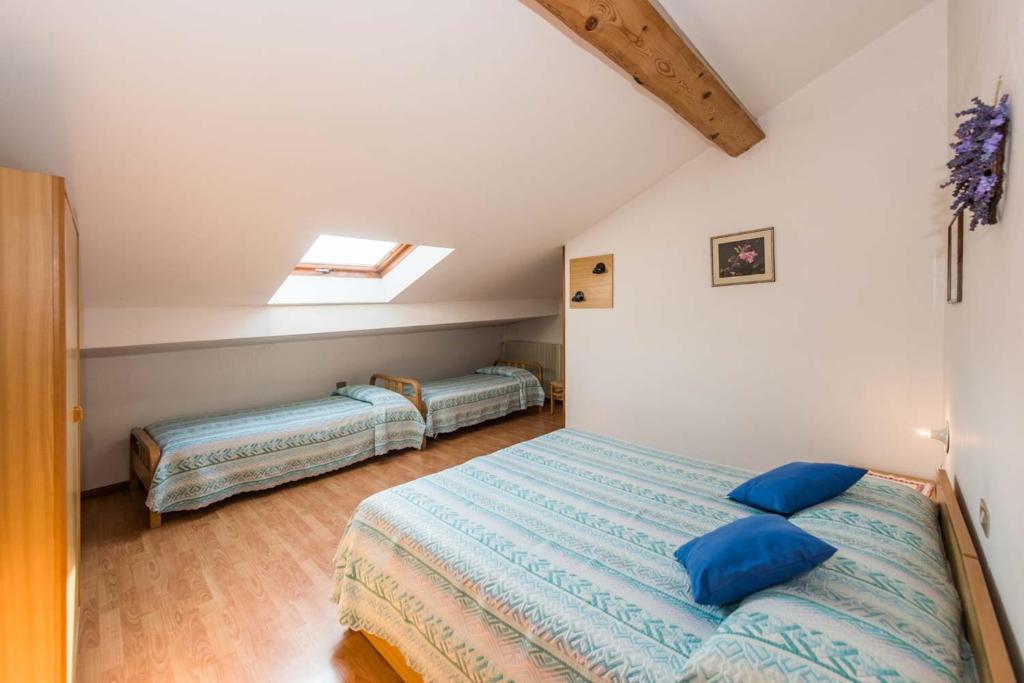 Postel nebo postele na pokoji v ubytování Albergo Antica Rosa