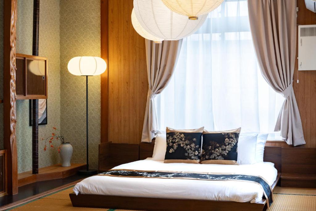 Postel nebo postele na pokoji v ubytování ヨミトピア