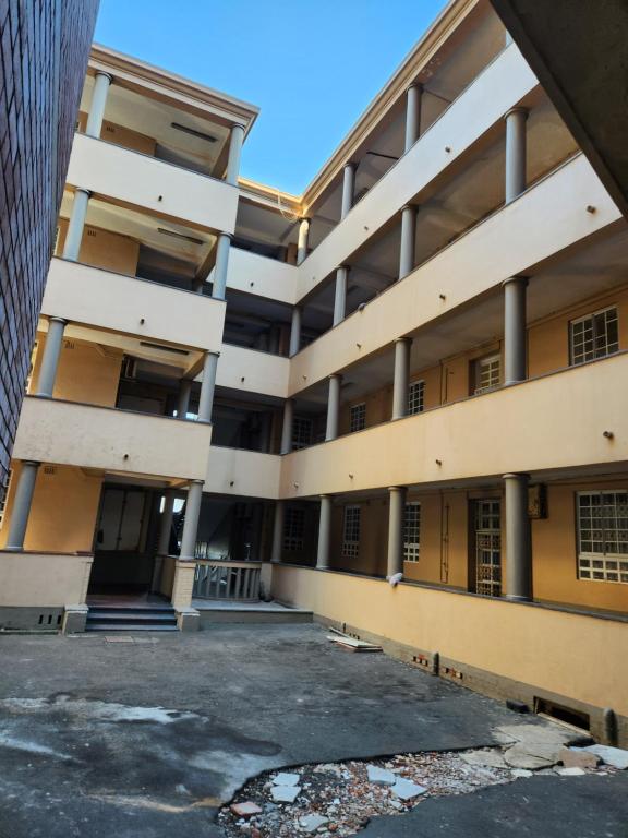 an empty parking lot in front of an apartment building at Beach Hurst in Durban