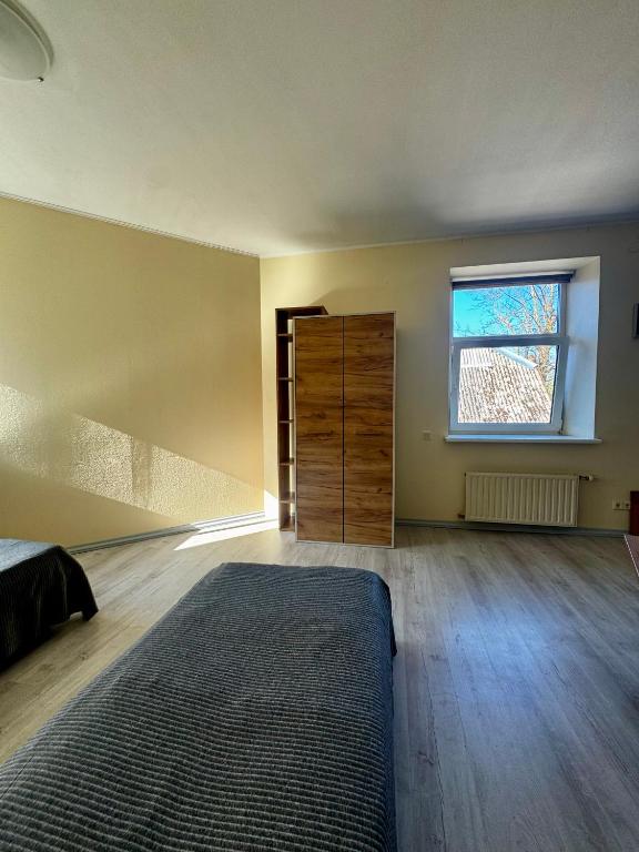 Postel nebo postele na pokoji v ubytování Vecpilsētas hostelis