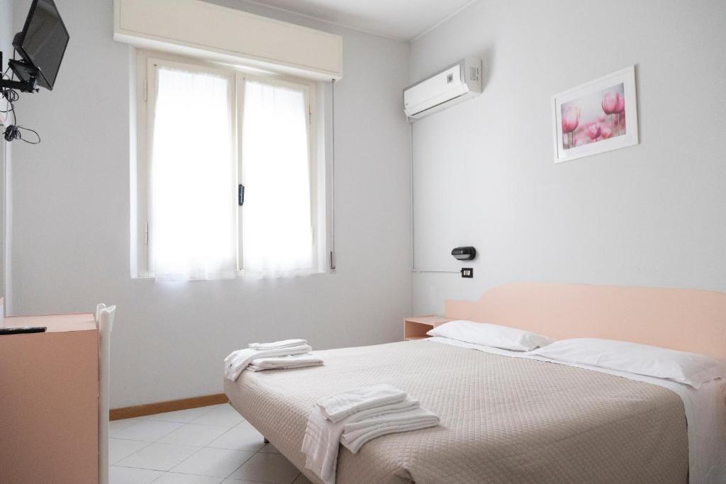 Postel nebo postele na pokoji v ubytování Hotel Laura Beach