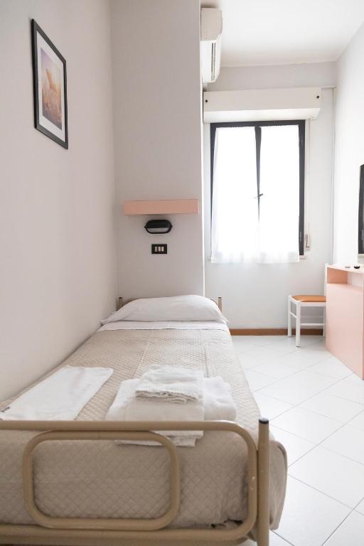 Postel nebo postele na pokoji v ubytování Hotel Laura Beach