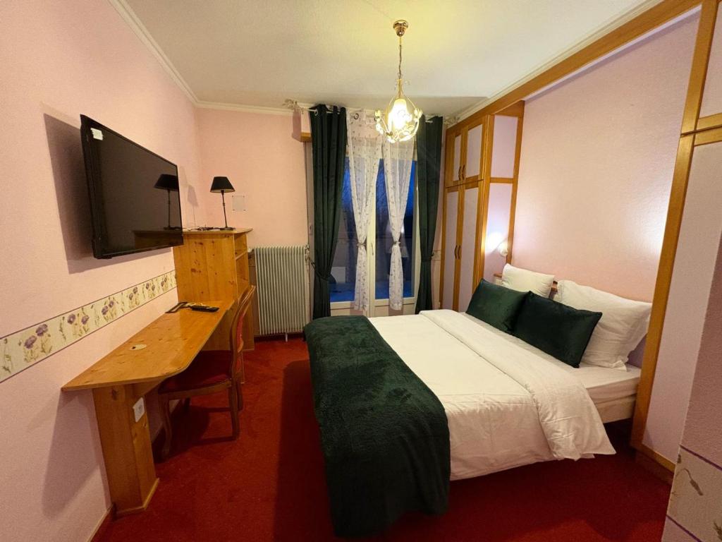 Postel nebo postele na pokoji v ubytování Hôtel l'Orée des Roches