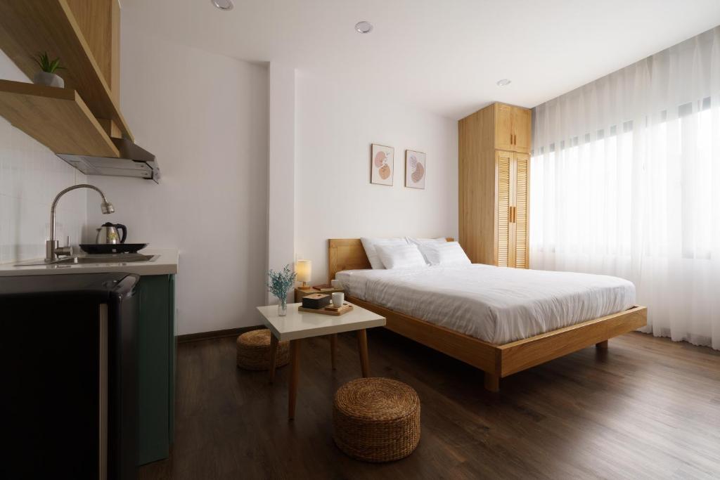 Postel nebo postele na pokoji v ubytování LATA Hotel & Apartments