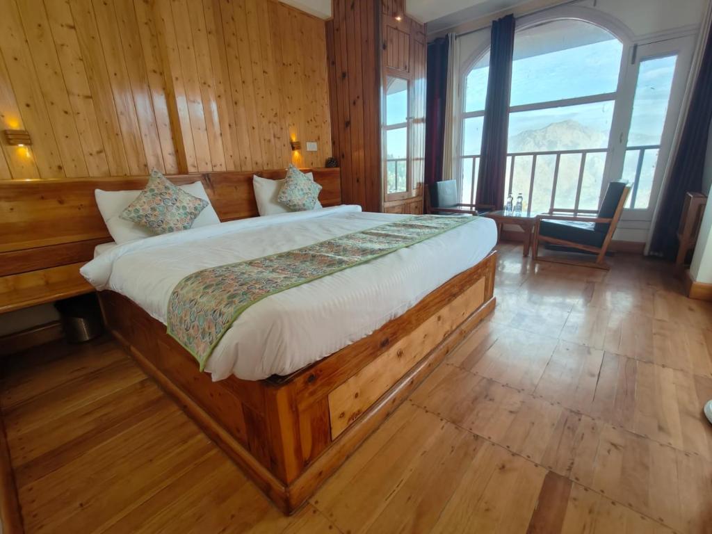 Postel nebo postele na pokoji v ubytování Hotel Sudrishya