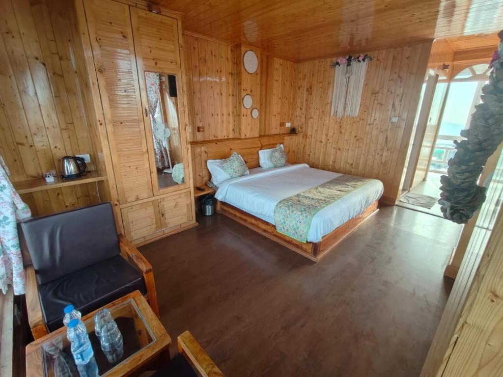 Postel nebo postele na pokoji v ubytování Hotel Sudrishya