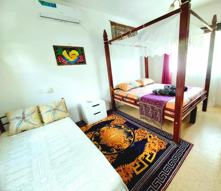 Postel nebo postele na pokoji v ubytování Ocean Breeze Guest House