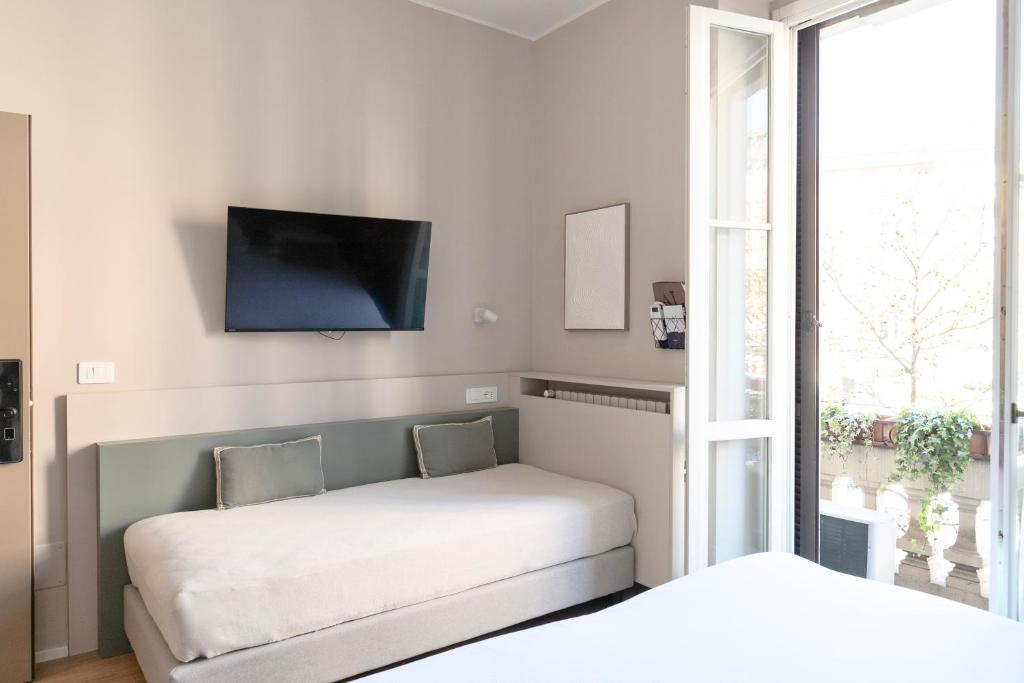 Postel nebo postele na pokoji v ubytování Aiello Hotels - Isola Design District