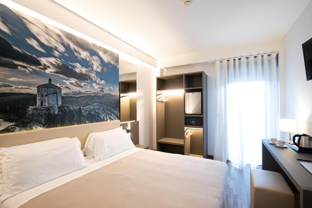 Postel nebo postele na pokoji v ubytování Hotel Federico II