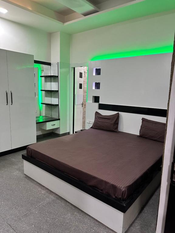 a bedroom with a bed in a room at Hotel Lotus Inn - Hisar in Hisār