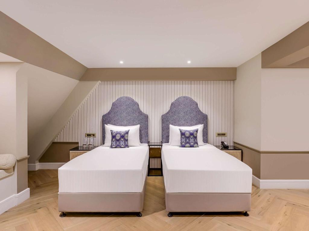 Postel nebo postele na pokoji v ubytování Grand Mercure Goa Candolim - An Accor Hotels Brand
