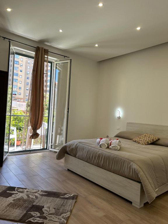 a bedroom with a bed with two stuffed animals on it at Casa Annachiara in Palermo
