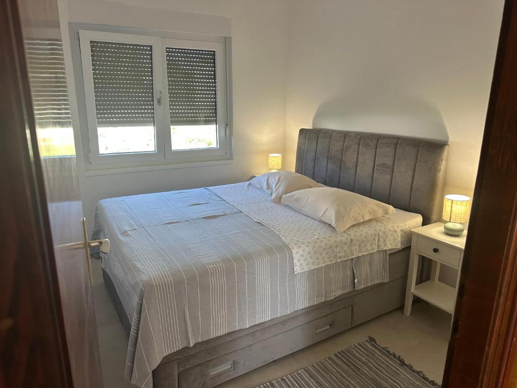 Postel nebo postele na pokoji v ubytování Apartments Iva