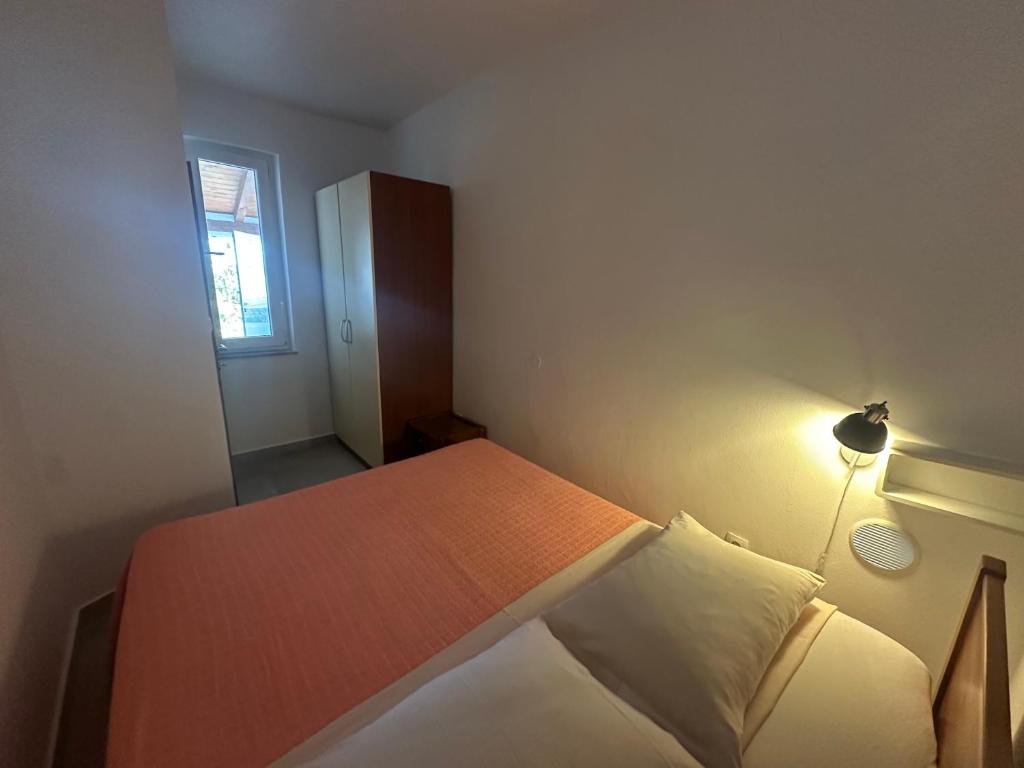 Postel nebo postele na pokoji v ubytování Apartments Iva