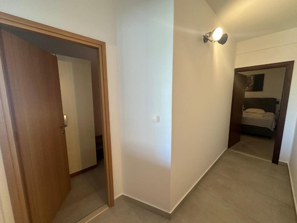 Postel nebo postele na pokoji v ubytování Apartments Iva