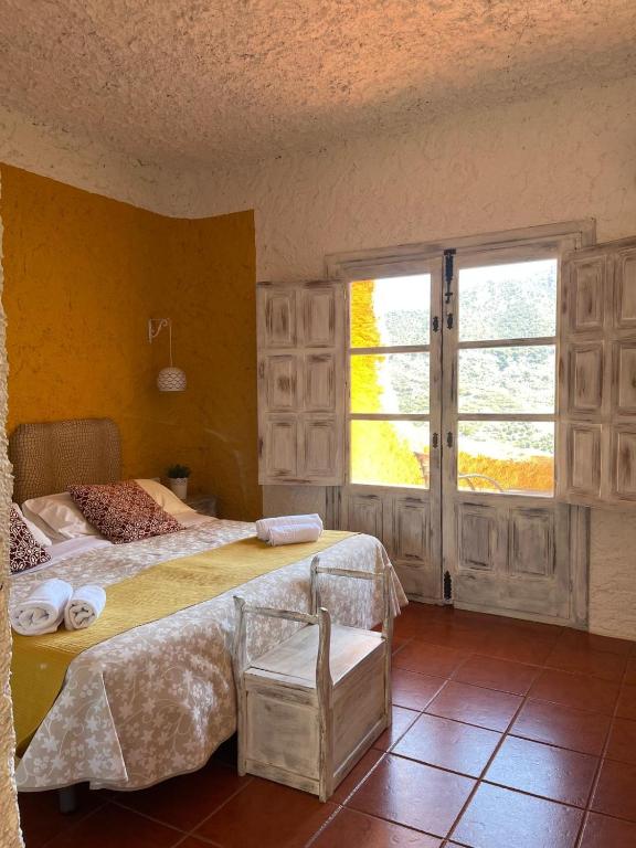 Cama o camas de una habitación en Hotel Rural los Caracoles