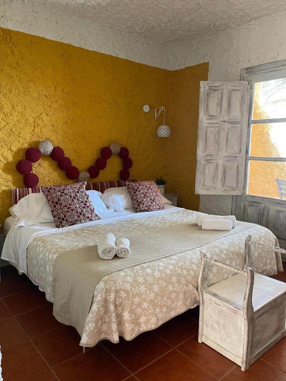 Cama o camas de una habitación en Hotel Rural los Caracoles