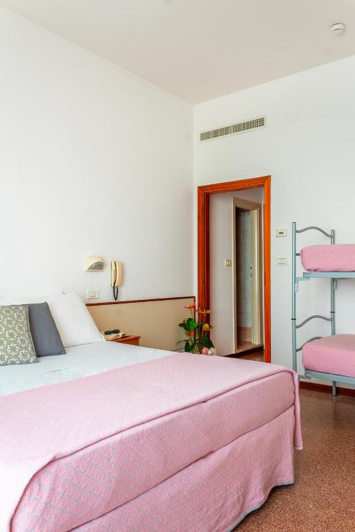 Postel nebo postele na pokoji v ubytování Mon Hotel