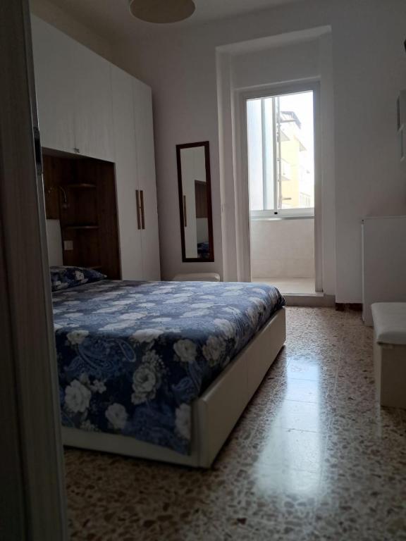 Postel nebo postele na pokoji v ubytování Camera Alghero Centro