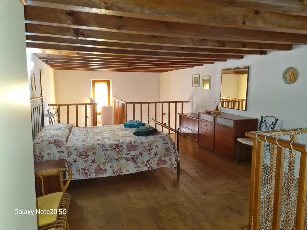 Postel nebo postele na pokoji v ubytování La Casa di Tella - Portopaglia free wifi - free parking