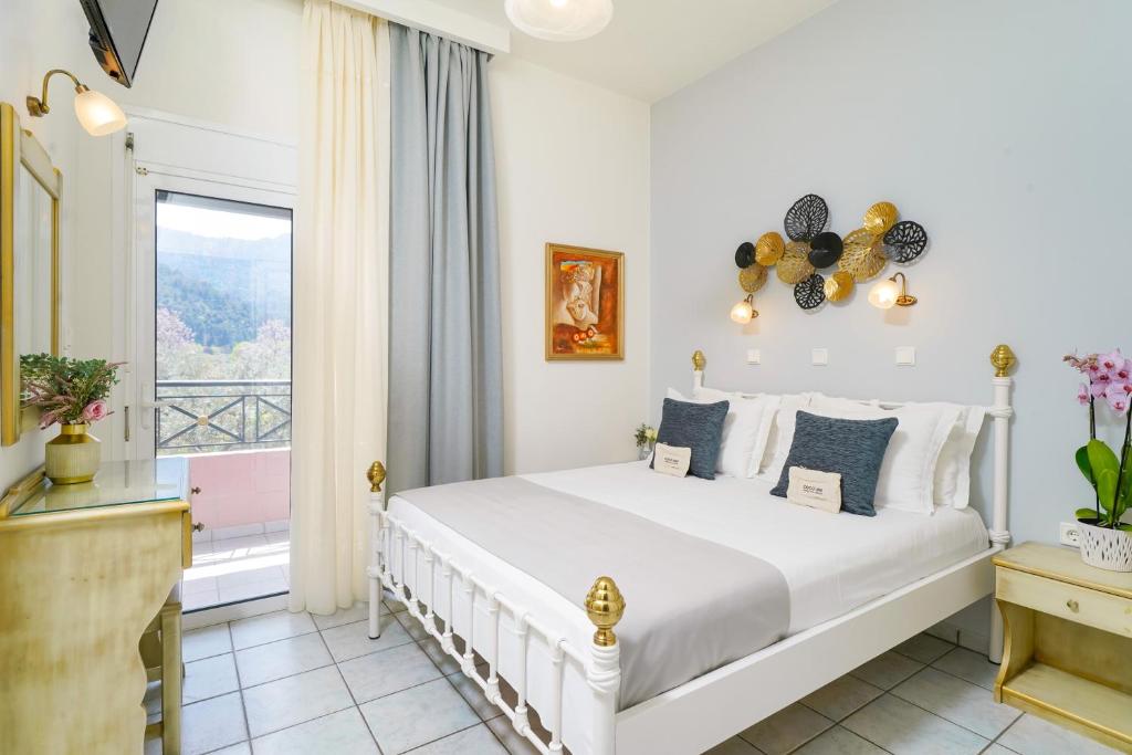 a bedroom with a bed and a window at Edem garden in Skala Potamias
