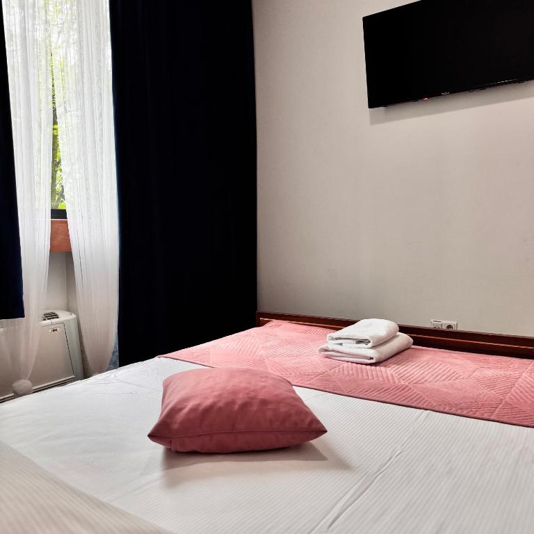 Postel nebo postele na pokoji v ubytování Hotel Paviljon