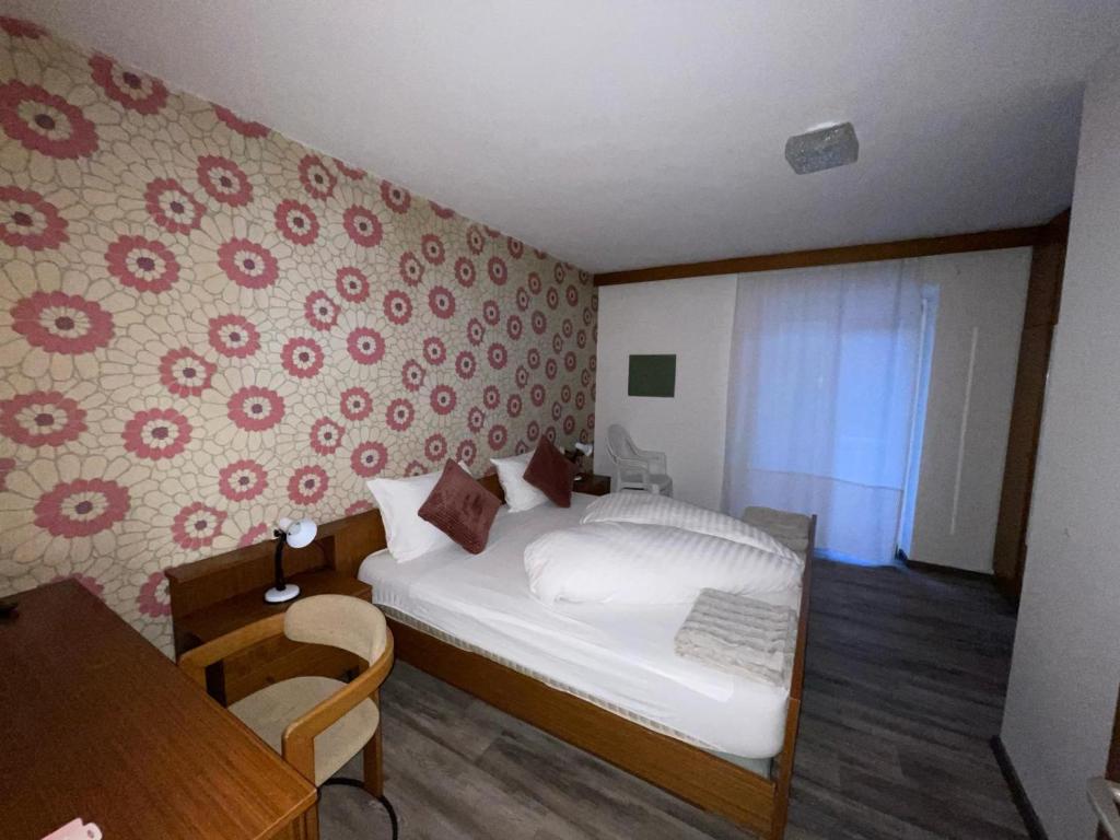 Postel nebo postele na pokoji v ubytování Hotel Mondschein