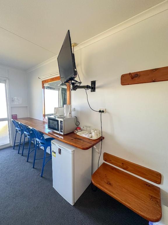 Kuchyň nebo kuchyňský kout v ubytování Ocean View Motel Bowen
