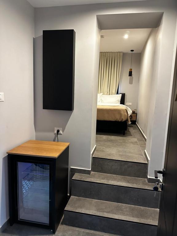 Postel nebo postele na pokoji v ubytování בוטיק רפאל Boutique Rafael