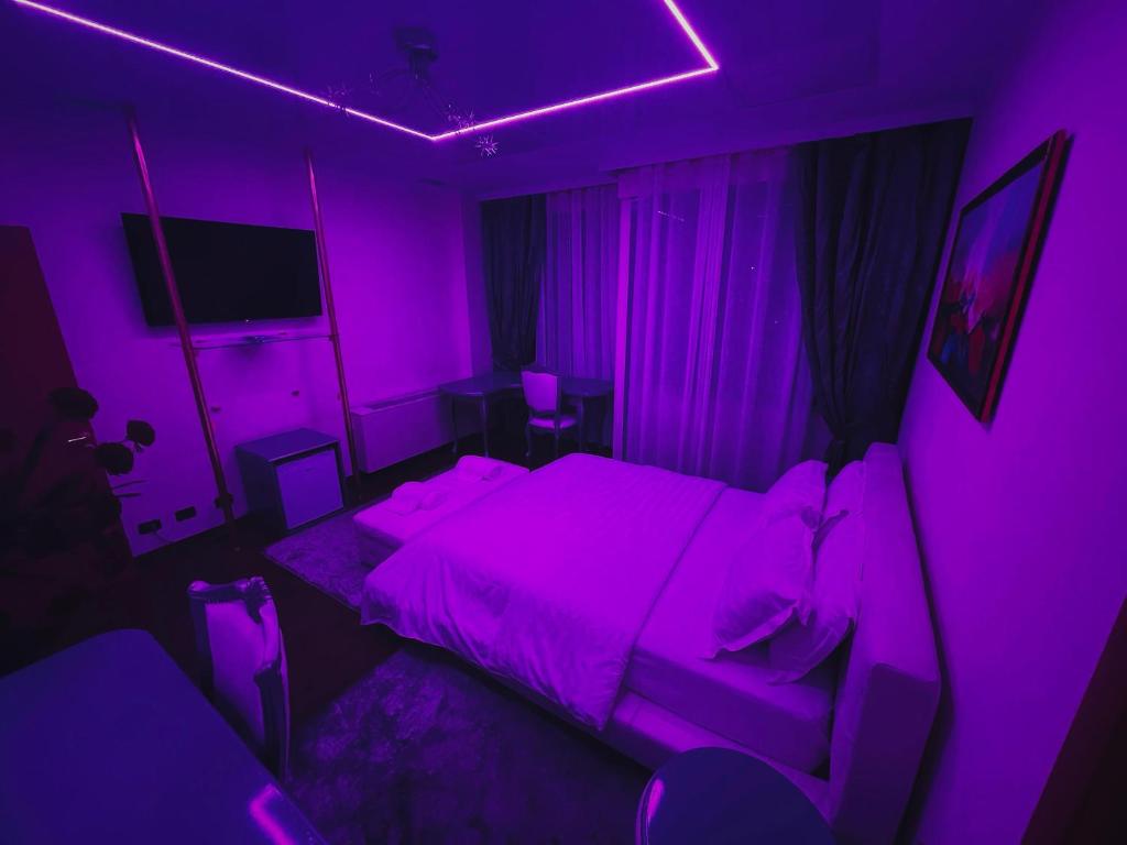 Llit o llits en una habitació de Hotel Rosa Blu