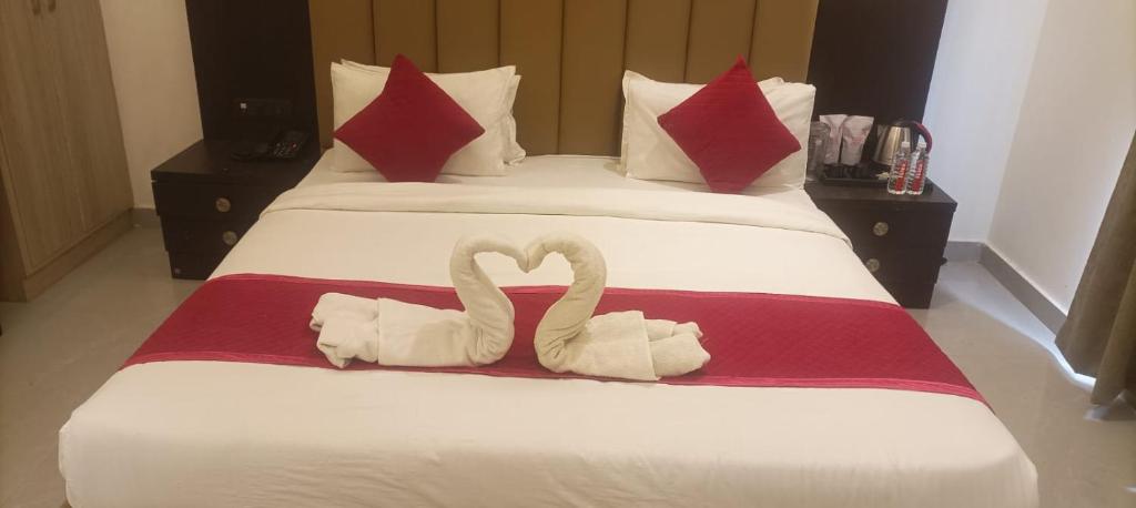 Postel nebo postele na pokoji v ubytování Hotel Grand Empire