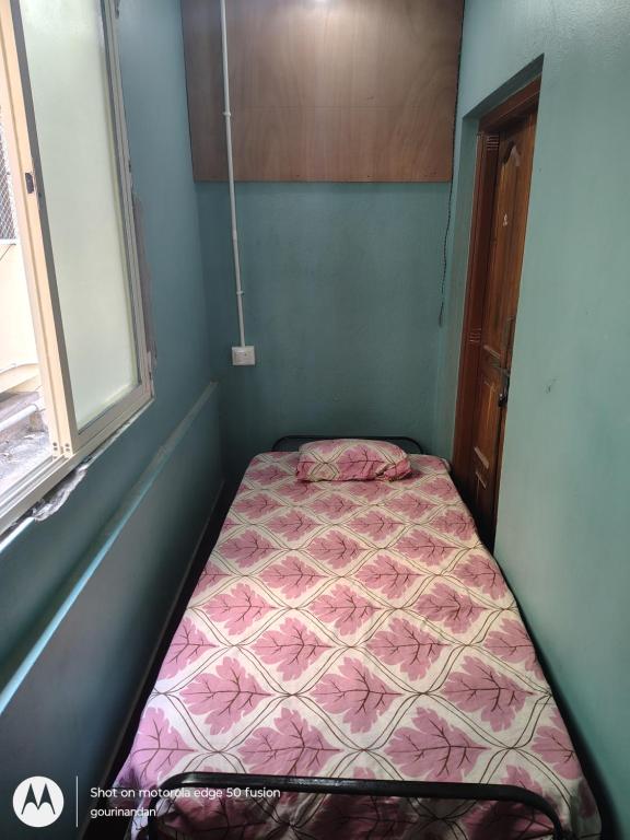 Postel nebo postele na pokoji v ubytování Gourinandan lodge