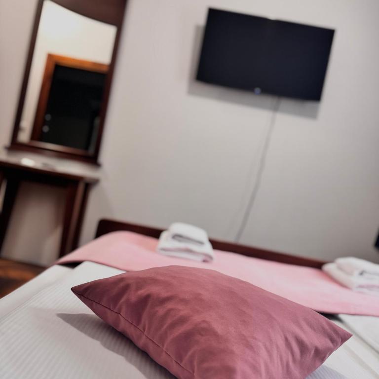 Postel nebo postele na pokoji v ubytování Hotel Paviljon