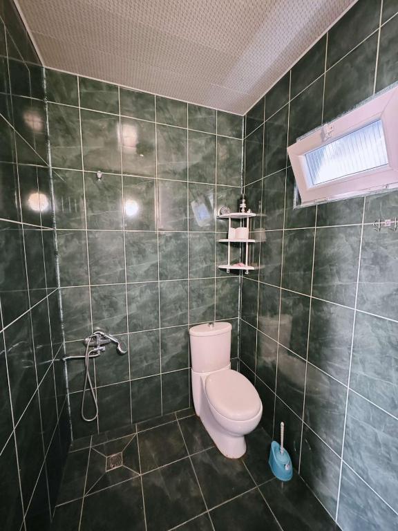 Koupelna v ubytování Achi Guest House