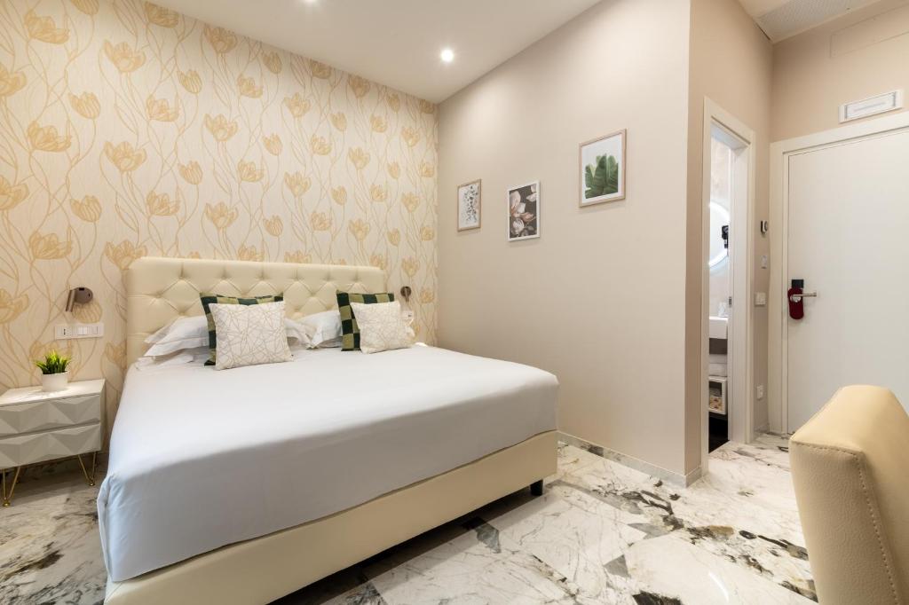 Postel nebo postele na pokoji v ubytování 69 Suite Boutique
