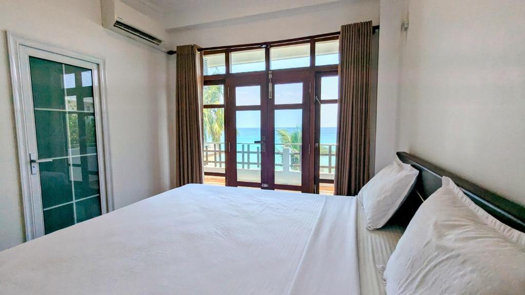 Postel nebo postele na pokoji v ubytování Dutch Villa - Trincomalee