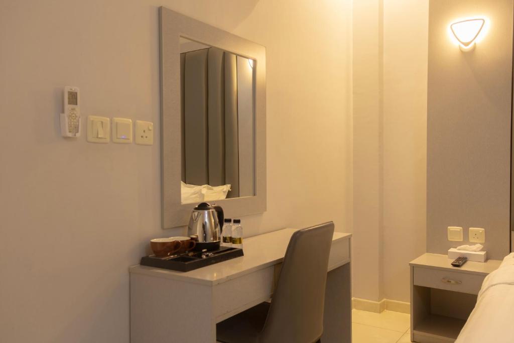 Postel nebo postele na pokoji v ubytování Areen Al Naeem Served Apartments